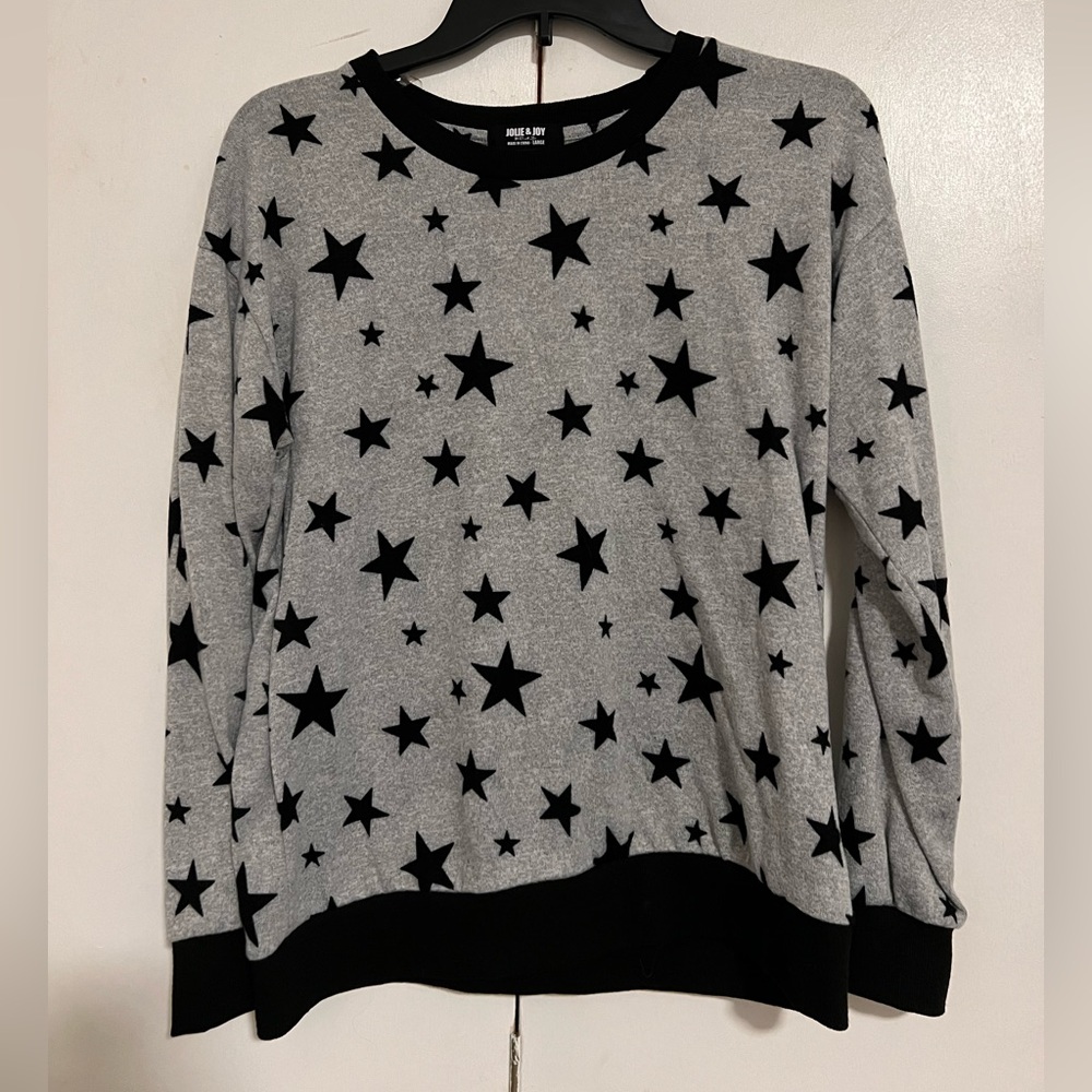 grey and black sweater w/ stars